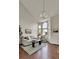 Bright living room with high ceilings, large windows, and stylish chandelier at 21455 E 44Th Ave, Denver, CO 80249