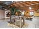 Finished basement offering an area for entertainment with a foosball and pool table at 4293 Clover Ln, Brighton, CO 80601