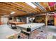 Finished basement with games like pool and air hockey, with an exposed ceiling design at 4293 Clover Ln, Brighton, CO 80601