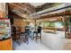 Finished basement showcasing entertaining area with a bar, pool table and a jungle themed wall at 4293 Clover Ln, Brighton, CO 80601