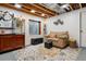 Cozy seating area in the finished basement with a popcorn machine at 4293 Clover Ln, Brighton, CO 80601