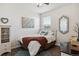 Cozy bedroom with a queen-sized bed, stylish decor, and a bright window at 4293 Clover Ln, Brighton, CO 80601