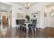 Dining room featuring hardwood floors, stylish chandelier, and furniture at 4293 Clover Ln, Brighton, CO 80601