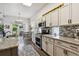 Bright kitchen with granite countertops, stainless steel appliances, and stylish backsplash at 4293 Clover Ln, Brighton, CO 80601