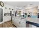 Bright kitchen with granite countertops, stainless steel appliances, an island, and light colored cabinetry at 4293 Clover Ln, Brighton, CO 80601