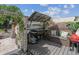 Outdoor kitchen with seating area, perfect for entertaining guests and enjoying the backyard ambiance at 4293 Clover Ln, Brighton, CO 80601