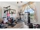 Bright workout room with large windows and an assortment of fitness equipment at 4293 Clover Ln, Brighton, CO 80601