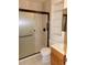 Bathroom with a shower, sliding glass doors, and built-in shelving at 1015 Alta St, Longmont, CO 80501