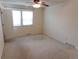 Bedroom with a ceiling fan and ample natural light from large windows at 1015 Alta St, Longmont, CO 80501