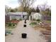 Outdoor community garden with gardening plots, tool shed, and gravel paths at 1015 Alta St, Longmont, CO 80501