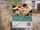 Sign promoting the Alta Park Community Garden, inviting people to garden together at 1015 Alta St, Longmont, CO 80501