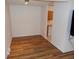 Bright dining area with wood floors and the kitchen in view at 1015 Alta St, Longmont, CO 80501