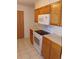 Functional kitchen features essential appliances including a range oven and a microwave at 1015 Alta St, Longmont, CO 80501