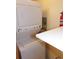 Convenient laundry area featuring a stackable washer and dryer unit with a built-in shelf at 1015 Alta St, Longmont, CO 80501