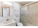 A tiled bathroom with updated sink, toilet and shower at 3195 S Kalispell Ct, Aurora, CO 80013