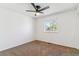 Cozy bedroom with neutral carpet, fan and natural light at 3195 S Kalispell Ct, Aurora, CO 80013