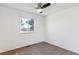 Cozy bedroom with neutral carpet, fan and natural light at 3195 S Kalispell Ct, Aurora, CO 80013