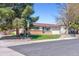 A charming single-story home with mature trees and a well-manicured lawn at 3195 S Kalispell Ct, Aurora, CO 80013