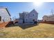Backyard featuring a lawn, privacy fence, patio, outdoor dining set, and a shed at 19603 E 63Rd Pl, Aurora, CO 80019