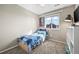 Bedroom with carpet, a window with blinds, a twin-sized bed, and a white shelving unit at 19603 E 63Rd Pl, Aurora, CO 80019