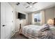 Bedroom with carpet, ceiling fan, TV, window with blinds and curtains, and a queen size bed at 19603 E 63Rd Pl, Aurora, CO 80019