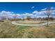 Large park with walking paths, benches, and well-maintained grass at 19603 E 63Rd Pl, Aurora, CO 80019
