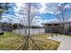 Outdoor pool surrounded by a fence with seating and bath house with bike racks at 19603 E 63Rd Pl, Aurora, CO 80019