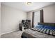 Comfortable bedroom setup as home office with modern desk and cozy queen bed at 21833 E Quincy Pl, Aurora, CO 80015