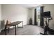 Bedroom with hardwood floor, work desk, exercise bike, and a window at 21833 E Quincy Pl, Aurora, CO 80015