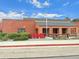 Brick building with covered walkways, landscaping, and the bold 'TRMS' sign in front at 21833 E Quincy Pl, Aurora, CO 80015
