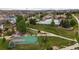 Aerial view of community pool, clubhouse, and basketball court nestled in a residential neighborhood at 21833 E Quincy Pl, Aurora, CO 80015