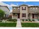 Charming two-story home with neutral siding, red shutters, and inviting front yard landscaping at 21833 E Quincy Pl, Aurora, CO 80015