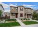 Charming two-story home with neutral siding, red shutters, and inviting front yard landscaping at 21833 E Quincy Pl, Aurora, CO 80015