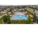 Aerial shot of a community pool and recreation center, with swimming pools and lounge areas visible at 21833 E Quincy Pl, Aurora, CO 80015