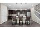Kitchen with a counter, dark cabinets, and stainless steel appliances at 21833 E Quincy Pl, Aurora, CO 80015