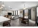 Open-concept living room features modern lighting, luxury vinyl plank floors, and sliding glass door at 21833 E Quincy Pl, Aurora, CO 80015