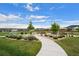 A scenic view of a community park with walking paths, playground, picnic tables, and landscaped areas at 21833 E Quincy Pl, Aurora, CO 80015