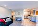 Inviting living room open to kitchen features modern accents and cozy atmosphere at 4246 S Eldridge St # 103, Morrison, CO 80465