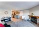 Spacious living room with stone fireplace, and seamless transition to the modern kitchen at 4246 S Eldridge St # 103, Morrison, CO 80465