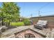 Inviting backyard with wooden deck, fire pit, and comfortable outdoor seating at 1292 Kearney St, Denver, CO 80220