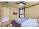 Cozy bedroom with hardwood floors, ceiling fan, barn door leading to the backyard and natural light at 1292 Kearney St, Denver, CO 80220