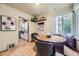 Cozy dining area with hardwood floors, natural light, and access to the adjacent kitchen at 1292 Kearney St, Denver, CO 80220