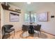 Bright dining area featuring hardwood floors, neutral paint, and natural light from the window at 1292 Kearney St, Denver, CO 80220