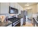 Well-equipped kitchen with stainless-steel appliances, modern cabinets, and hardwood floors at 1292 Kearney St, Denver, CO 80220