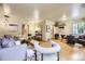 Open-concept living area showcasing hardwood floors and ample seating, great for entertaining guests at 1292 Kearney St, Denver, CO 80220