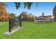 Scenic view of Montclair Park with green lawns and a historic building in the background at 1292 Kearney St, Denver, CO 80220