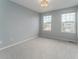 Bedroom features a neutral color palette and ample natural light from two large windows at 2822 Flint Ct, Superior, CO 80027