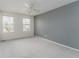 Large bedroom with gray accent wall and bright natural light at 2822 Flint Ct, Superior, CO 80027