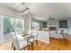 Dining area with a glass table, chairs, and sliding glass doors leading to a deck at 2822 Flint Ct, Superior, CO 80027