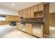 Basement kitchenette area with wood cabinets and stainless steel appliances at 2822 Flint Ct, Superior, CO 80027